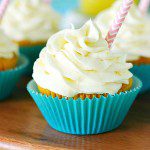 pineapple dole whip cupcakes filled with fresh Pineapple curd and topped with pineapple buttercream frosting