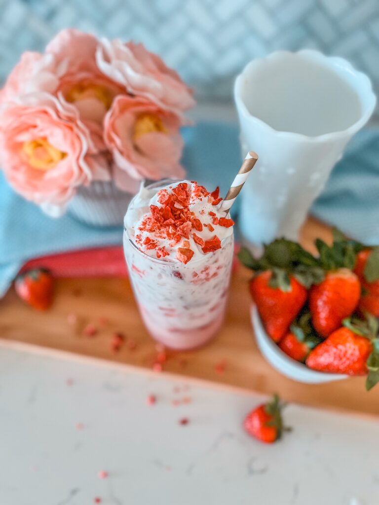 Healthy Pink Drink Inspired by Starbucks’ Pink Drink but without the added sugar and guilt. It’s made with fresh strawberries, monk fruit sweetener, coconut milk creamer, Olipop soda and dairy free whipped topping. Don’t forget the freeze dried strawberries!