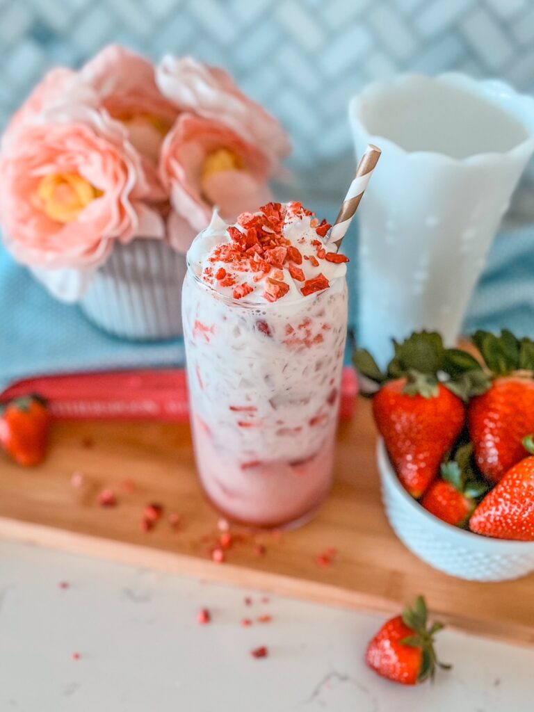 Healthy Pink Drink Inspired by Starbucks’ Pink Drink but without the added sugar and guilt. It’s made with fresh strawberries, monk fruit sweetener, coconut milk creamer, Olipop soda and dairy free whipped topping. Don’t forget the freeze dried strawberries!
